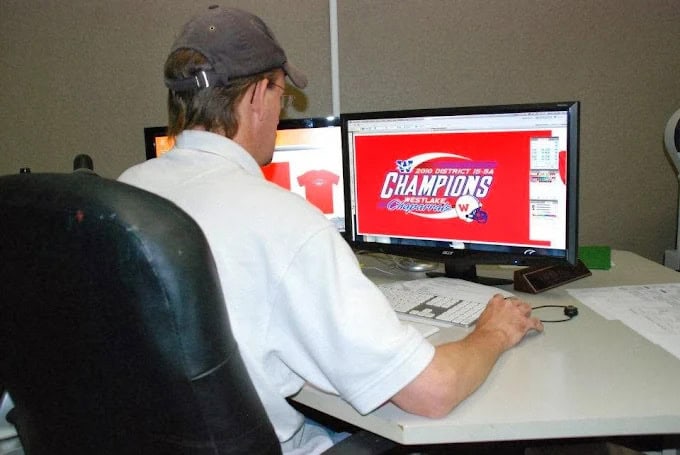 embroidery-digitizing A RiverCity employee digitizing a logo on his computer.